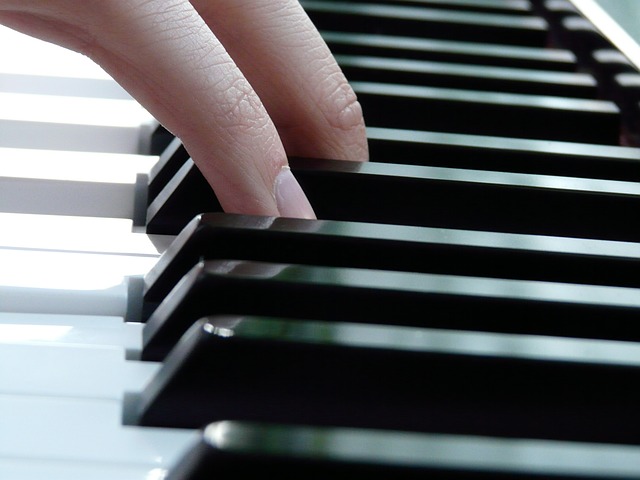 Fingers on piano keys